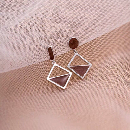 Asymmetric frosted heart earrings in silver — RABUKO